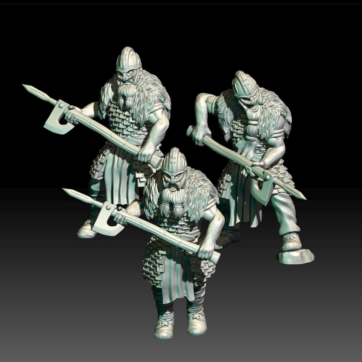 Three dark fantasy viking warrior minaitures with armour and great weapons