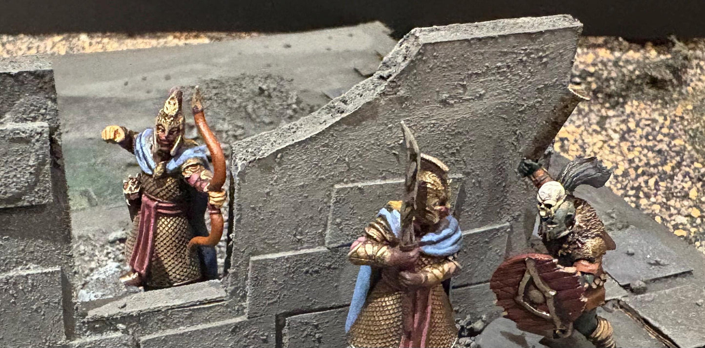 3D printed dark fantasy elf miniatures face off against an orc warrior during a tabletop skirmish game