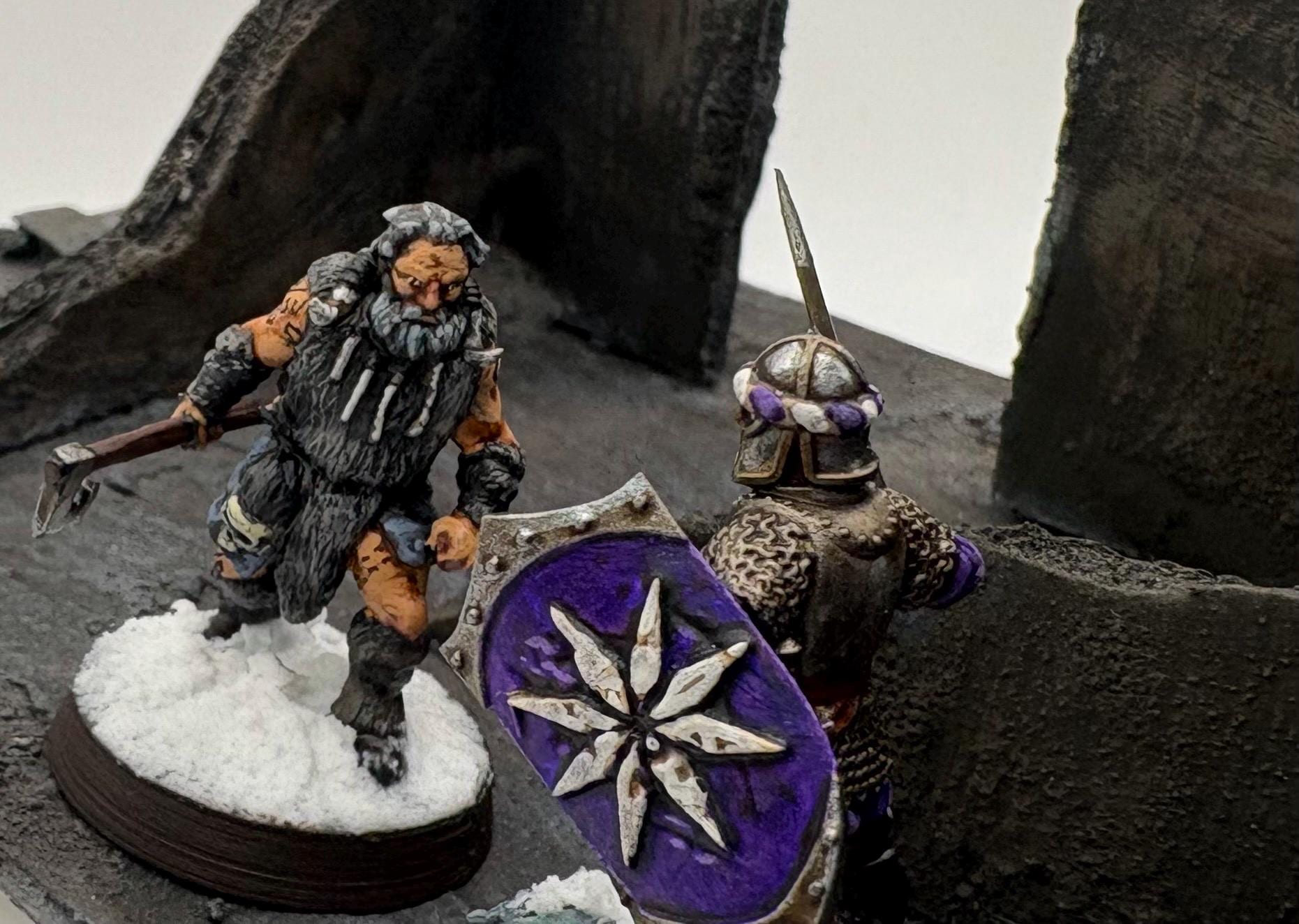 dynamic shot of 3d printed dark fantasy hillmen battling a dark fantasy knight miniatures