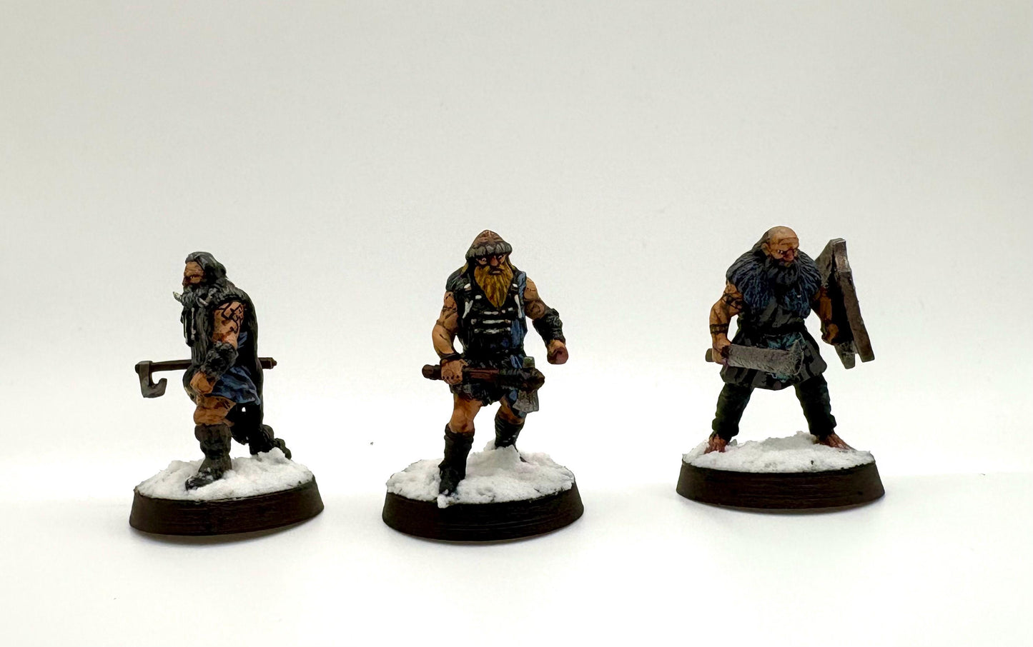 hand painted 3d printed hillmen miniatures on a white background